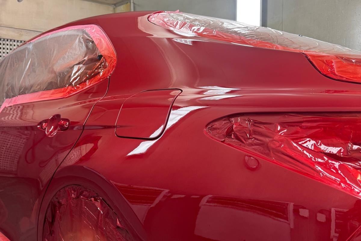After: the same rear quarter panel repaired and resprayed in factory colour
